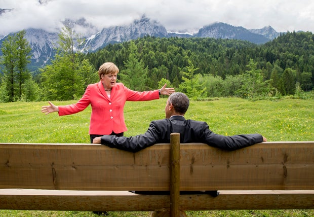 German Chancellor Angela Merkel speaks with President Obama outside the Elmau castle in Kruen near Garmisch-Partenkirchen, Germany, June 8, 2015, at a summit of the leaders of the Group of Seven (G7) industrial nations.