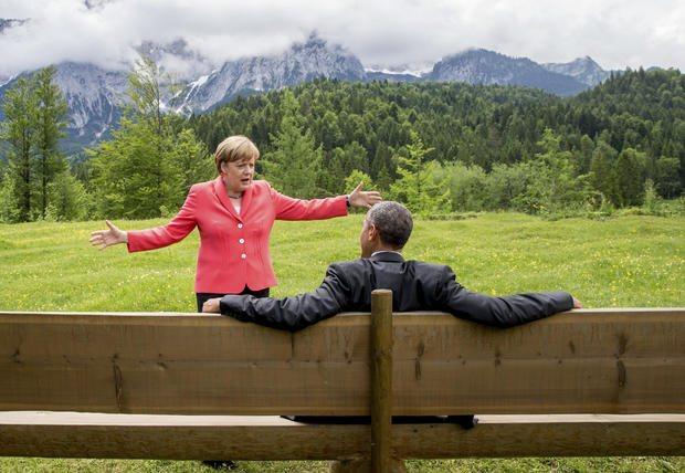 German Chancellor Angela Merkel speaks with President Obama outside the Elmau castle in Kruen near Garmisch-Partenkirchen, Germany, June 8, 2015, at a summit of the leaders of the Group of Seven (G7) industrial nations. 