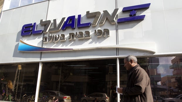 A man walks past an office of Israeli airline El Al in Tel Aviv Jan. 16, 2012. 