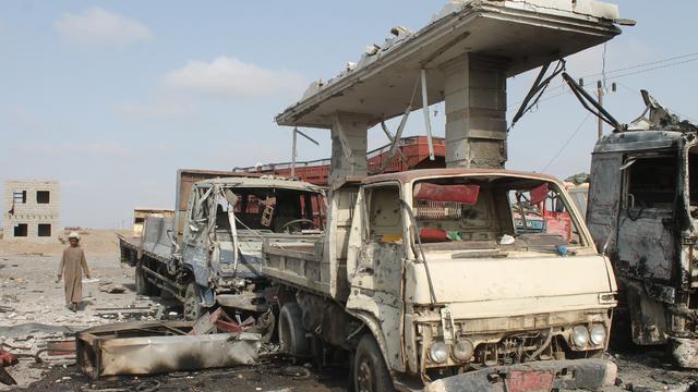 Destruction is seen at an oil installation reportedly used by Yemen's Houthi rebel forces following Saudi-led coalition aristrikes on the northern outskirts of Aden, in the south of the country 