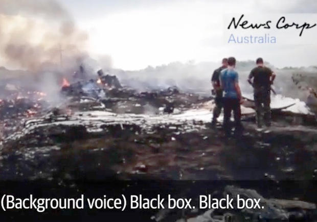 Video obtained by News Corp Australia shows pro-Russian rebels at the scene of the Malaysia Airlines Flight 17 crash in Hrabove, eastern Ukraine, soon after it was brought down by a missile, July 17, 2014. 