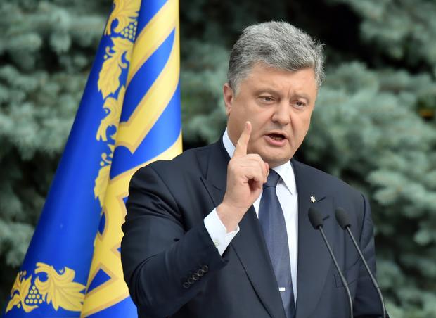 Ukrainian President Petro Poroshenko gestures as he speaks to media in Kiev 