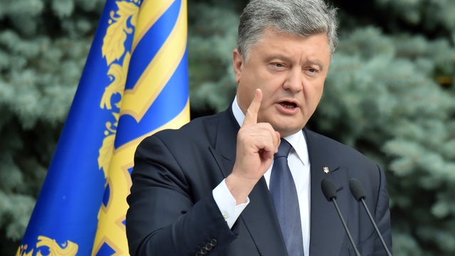 Ukrainian President Petro Poroshenko gestures as he speaks to media in Kiev 