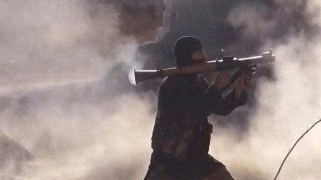 ​An unidentified ISIS fighter appears in a propaganda video released by the militant group. 