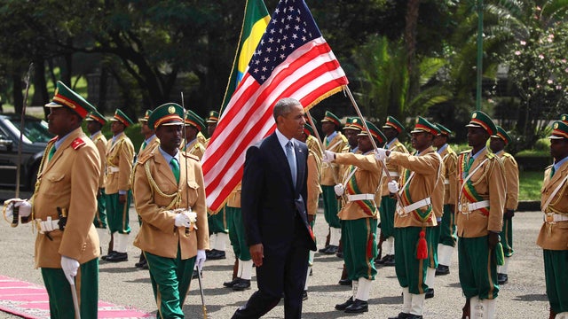 President Obama reviews a marsh band during a welcome ceremony at the National Palace in Addis Ababa 