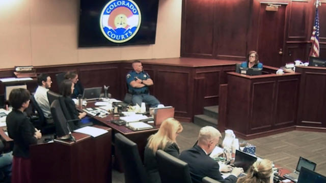 Arlene Holmes, top right, the mother of James Holmes, second from left, in white shirt, gives testimony during the sentencing phase of the Colorado theater shooting trial in Centennial, Colo., July 29, 2015, in this image made from Colorado Judicial Depar 