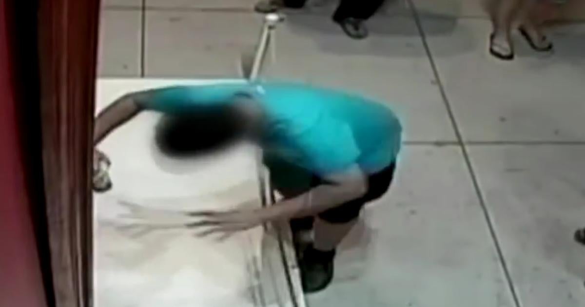 Taiwan boy stumbles, punches hole through $1.5 million painting - CBS News