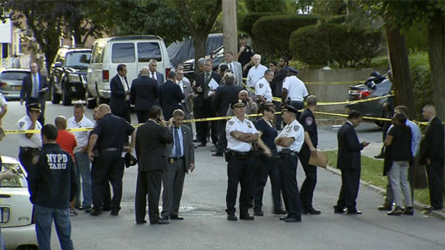 ​New York police officers work the scene after an undercover gun buy that went bad in Mount Vernon Aug. 29, 2015. 