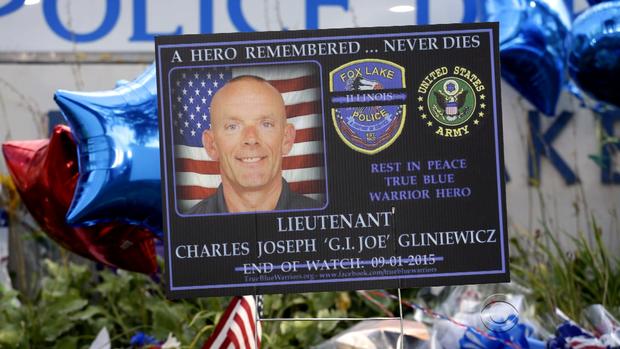 Sign outside Fox Lake, Illinois police headquarters pays tribute to Lt. Charles Joseph Gliniewicz, who was shot and killed September 1, 2015 