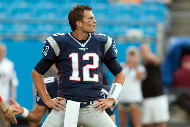 New England Patriots quarterback Tom Brady (12) stretches prior to the game against the Carolina Panthers at Bank of America Stadium in Charlotte, North Carolina, Aug. 28, 2015. 
