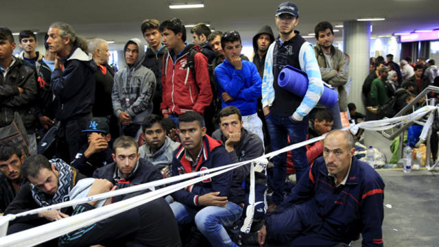 Migrants, who mostly crossed into Hungary from Serbia and are hoping to make their way to Austria, wait for trains heading to Hegyeshalom or Gyor in a transit area at Keleti station in Budapest, Hungary, Sept. 12, 2015.  