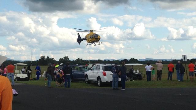 An emergency helicopter takes off to assist in the rescue effort after a plane crash during an air show Sept. 12, 2015, in Oneida, Tennessee. 