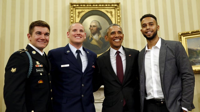 President Obama poses for pictures with Spencer Stone, 2nd left, Anthony Sadler, right, and Alek Skarlatos, left, the three men who subdued a gunman on a Paris-bound train in August, at the Oval Office at the White House in Washington Sept. 17, 2015. 