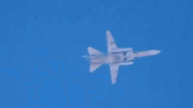 A fighter jet believed to be Russian is seen flying over Latamneh, in the northern Syrian governate of Hama, Sept. 30, 2015, in video posted online by anti-government activists. 