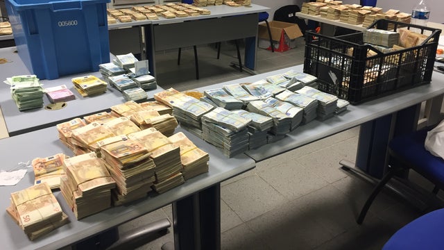 ​About $2.1 million dollars in foreign currency, largely 50 euro notes, is displayed by French Customs officials who siezed the cash from a vehicle driven by an unidentified man 