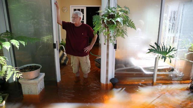 Nelson Shields stands in his flooded home Oct. 7, 2015, in Summerville, South Carolina. 