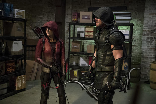 Willa Holland as Speedy and Stephen Amell as The Arrow 