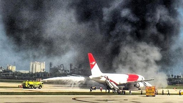 ​Crews work to extinguish a plane fire at Fort Lauderdale-Hollywood International Airport in Fort Lauderdale, Florida, Oct. 29, 2015. 