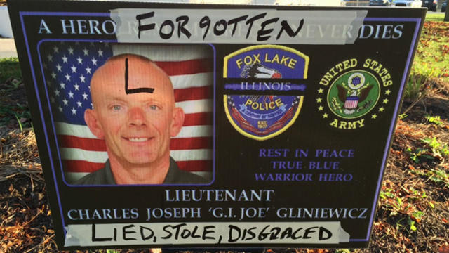 A defaced memorial sign for police Lt. Charles Joseph Gliniewicz was placed outside the police department in Fox Lake, Illinois, Nov. 4, 2015. 