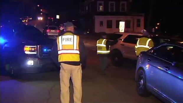 ​Crews work the scene after a deadly shooting in Oakland, Maine, Nov. 4, 2015. 