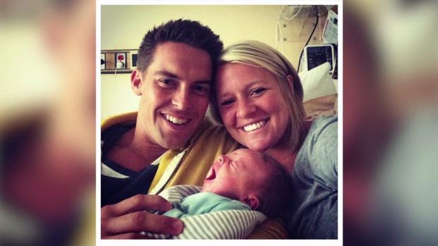Davey and Amanda Blackburn with their son. 