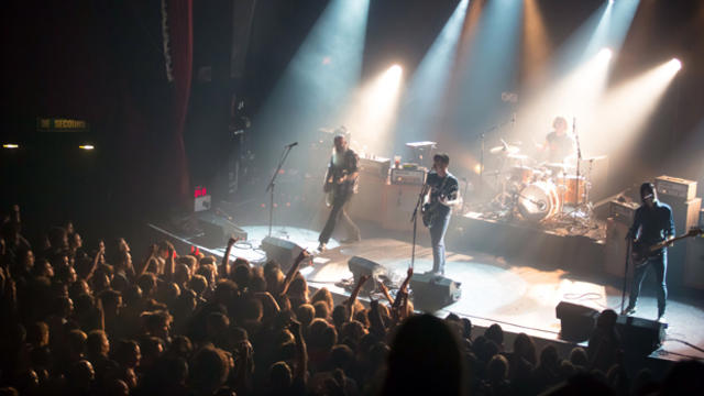 American rock group Eagles of Death Metal perform on stage Nov. 13, 2015, at the Bataclan concert hall in Paris a few moments before men armed with assault rifles and shouting "Allahu akbar" ("God is great!") stormed into the venue. 