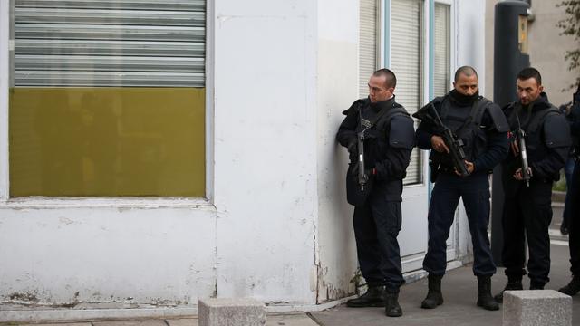 French police secure the area as shots are exchanged in Saint-Denis, France, near Paris, November 18, 2015 during an operation to catch fugitives from Friday night's deadly attacks in the French capital 