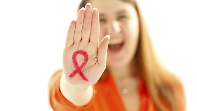 woman-red-ribbon-fighting-hiv-aids.jpg 