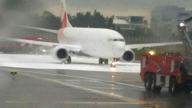 Air China jetliner on the tarmac that fire fighters mistakenly sprayed with foam 