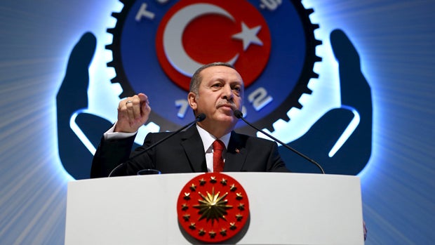 Turkey's President Recep Tayyip Erdogan addresses the audience during a meeting in Ankara, Turkey, Dec. 3, 2015. 
