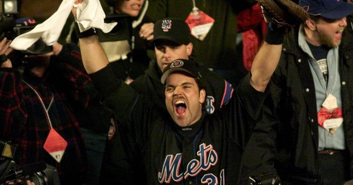 Mike Piazza of the San Diego Padres acknowledges the fans on his