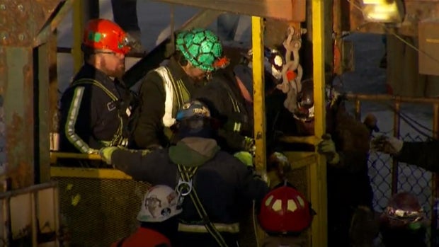 Rescued salt miners reach the surface after spending about 10 hours stuck hundreds of feet underground at the Cargill-owned Cayuga Salt Mine in Lansing, New York, Jan. 7, 2016. 
