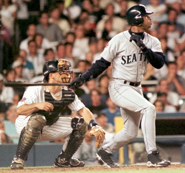 Seattle Mariners' Ken Griffey Jr. (R) watches his 