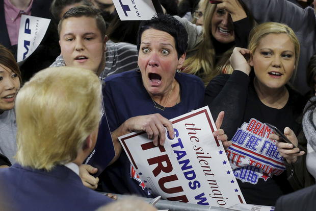 Audience member Robin Roy, center, reacts as Republican presidential candidate Donald Trump greets her at a campaign rally in Lowell, Massachusetts, Jan. 4, 2016. 