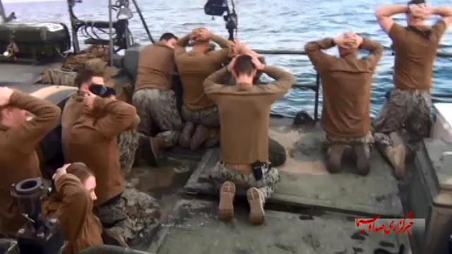 This picture released by the Iranian state-run IRIB News Agency on Jan. 13, 2016, shows the detention of American Navy sailors by the Iranian Revolutionary Guard in the Persian Gulf, Iran. 