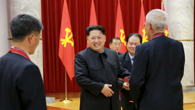 North Korean leader Kim Jong Un attends a ceremony to award party and state commendations to nuclear scientists, technicians, soldier-builders, workers and officials for their contribution to what North Korea said was a successful hydrogen bomb test, at t 