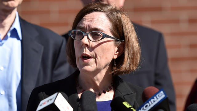 Oregon Gov. Kate Brown reacts during a press conference in Roseburg, Oregon, on Oct. 2, 2015. 