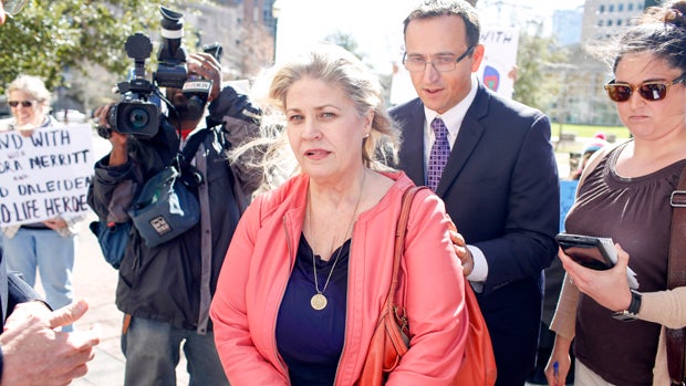 Sandra Merritt, a defendant in an indictment stemming from a Planned Parenthood surreptitious video she helped produce, walks with her lawyers after appearing in court at the Harris County Criminal Courthouse Feb. 3, 2016, in Houston, Texas. 