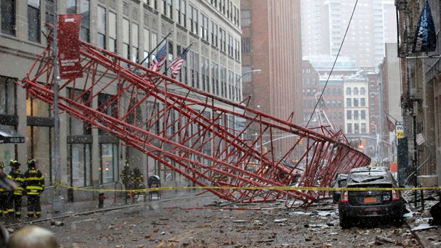 Emergency crews survey a massive construction crane collapse on a street in lower Manhattan in New York Feb. 5, 2016. 
