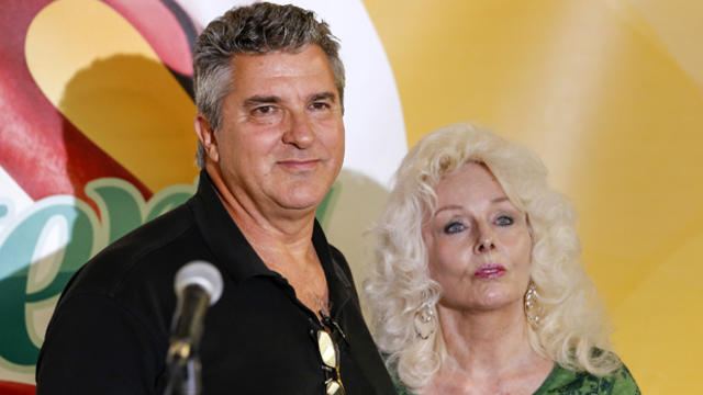 David Kaltschmidt and Maureen Smith of Melbourne Beach, Florida, talk to reporters during a news conference after claiming their share from the historic Powerball jackpot at the state's lottery headquarters in Tallahassee Feb. 17, 2016. 