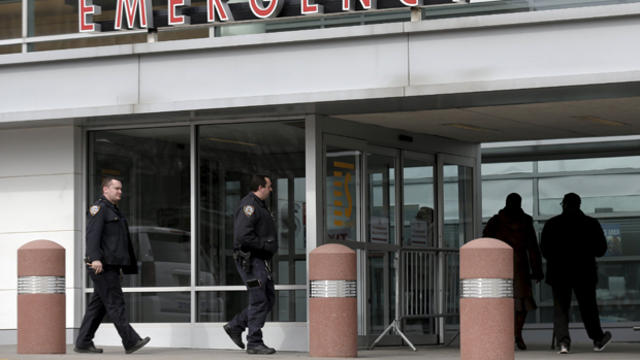 New York City police officers arrive at the emergency entrance of Kings County Hospital in the Brooklyn borough of New York Feb. 20, 2016. 