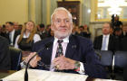 Former astronaut Buzz Aldrin takes his seat to testify before a Senate Subcommittee on Space, Science and Competitiveness hearing on Capitol Hill in Washington Feb. 24, 2015. 