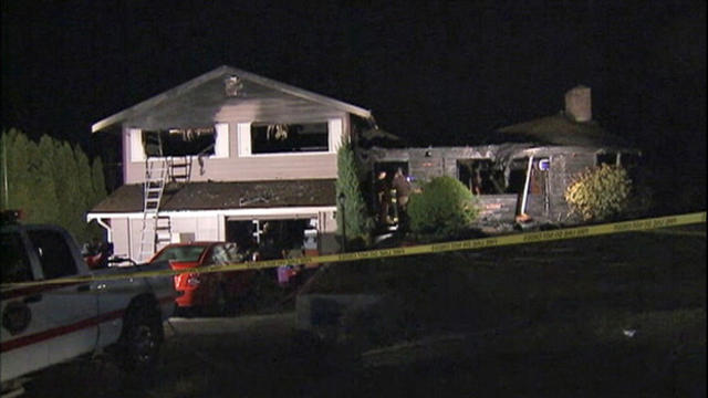 ​Crews work the scene after a deadly house fire in Centralia, Washington, March 4, 2016. 