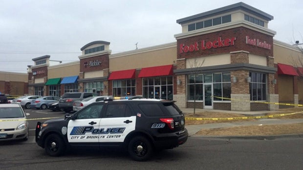 ​Crews work the scene after a shooting outside a Foot Locker store in Brooklyn Center, Minnesota, March 5, 2016. 