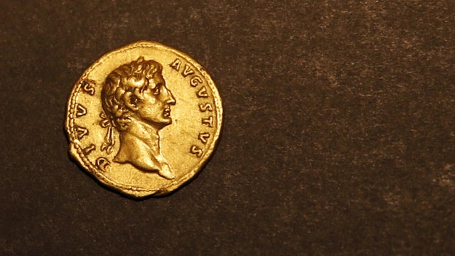 A nearly 2000 year-old gold coin which bears the image of Emperor Augustus and was minted by Emperor Trajan, is displayed for members of the media in the Israel Museum in Jerusalem 