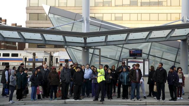 ​Morning commuters await a bus for downtown Washington in Silver Spring, Maryland, March 16, 2016. 