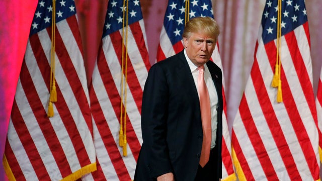 Republican presidential candidate Donald Trump arrives to give a victory speech after the Florida, Ohio, North Carolina, Illinois and Missouri primary elections in Palm Beach, Florida, on March 15, 2016. 