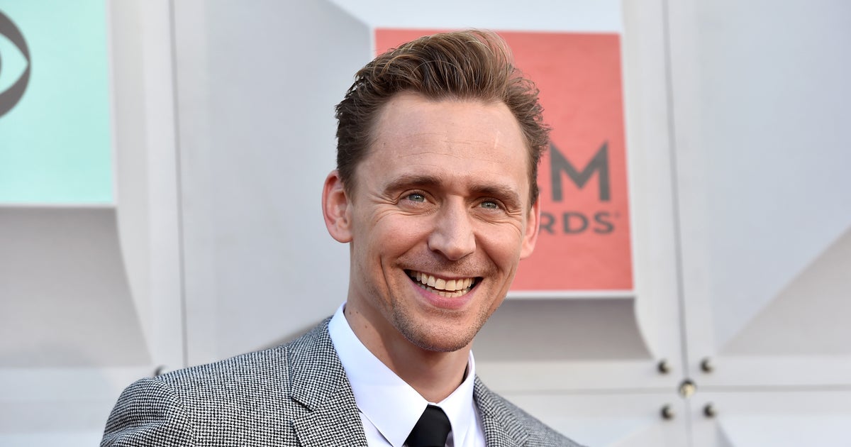 Tom Hiddleston finally explains why he wore that Taylor Swift tanktop