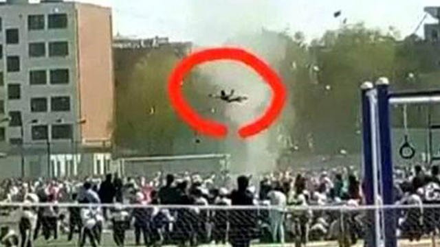 ​An image broadcast on Chinese state television shows a boy flying through the air after being lifted off the ground by a dust devil at his school in Gansu Province 