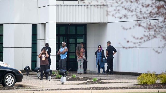 Friends and employees gather outside of Paisley Park, U.S. music superstar Prince's estate in Chanhassen, Minnesota, April 21, 2016. 